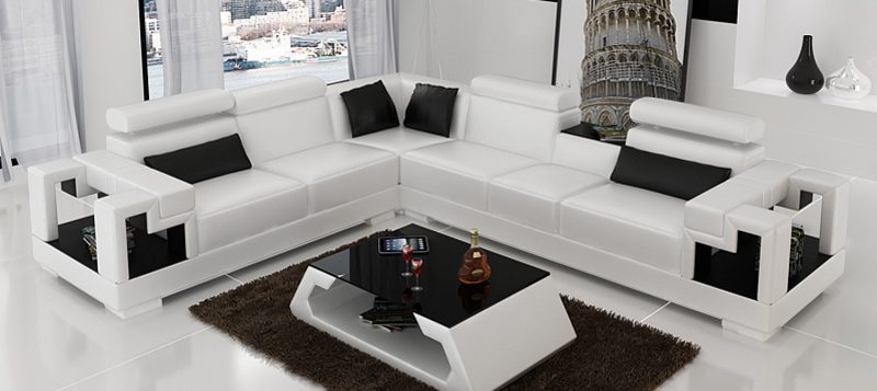 Fancy Homes Aliant-B corner leather sofa in white and black colour with storage armrests, adjustable headrests and in-built middle table. Matching coffee table is also available to create a cohesive home interior