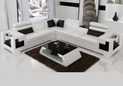 Fancy Homes Aliant-B corner leather sofa in white and black leather featuring in-built middle table, adjustable headrests and storage armrests. Matching coffee table is also available to create a cohesive look