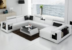 Fancy Homes Aliant modular leather sofa in white and black leather featuring in-built middle table, storage armrests and adjustable headrests