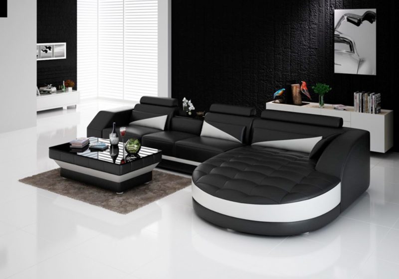 Fancy Homes Savino-C chaise leather sofa in black and white leather featuring round chaise, in-built coffee table and adjustable headrests