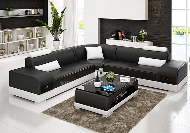 Fancy Homes Aura-C corner leather sofa in black and white leather features storage armrests and adjustable headrests