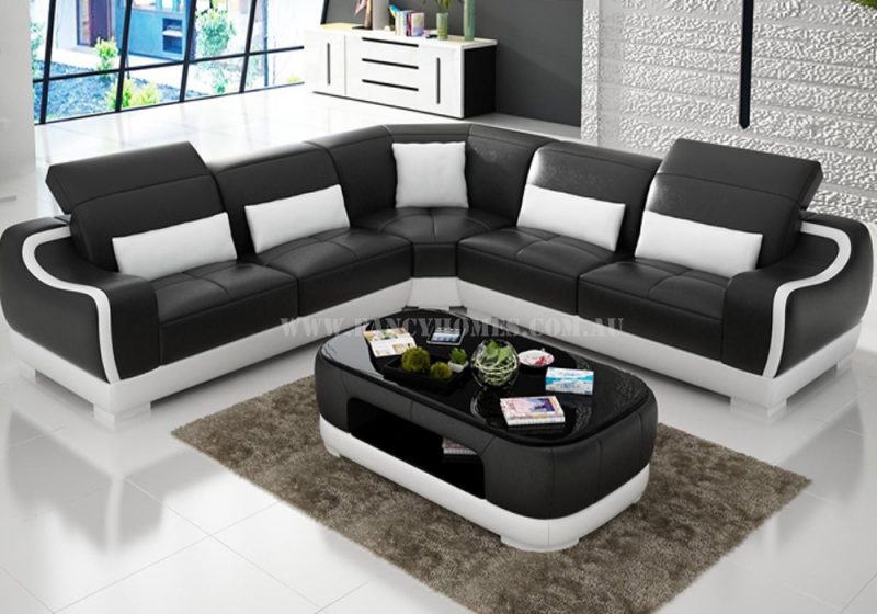 Fancy Homes Doreen-B corner leather sofa in black and white leather featured with uniquely designed armrests and adjustable headrests