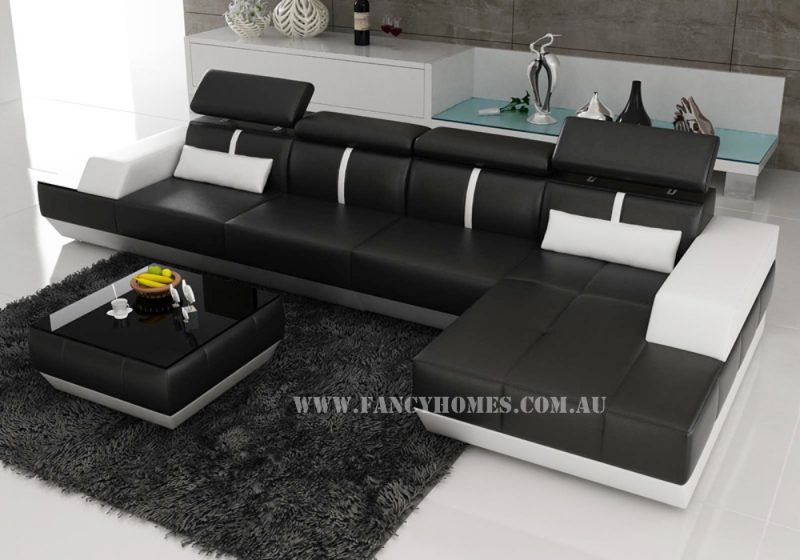 Fancy Homes Elite-B chaise leather sofa in black and white leather with built-in side table and adjustable headrests