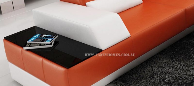 The in-built side table from Fancy Homes Elite-B chaise leather sofa comes with tempered glass