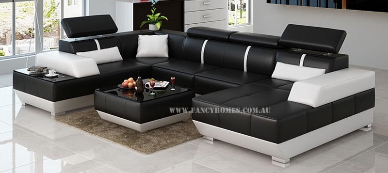 Fancy Homes Elite modular leather sofa in black and white leather featured with in-built side table and adjustable headrests