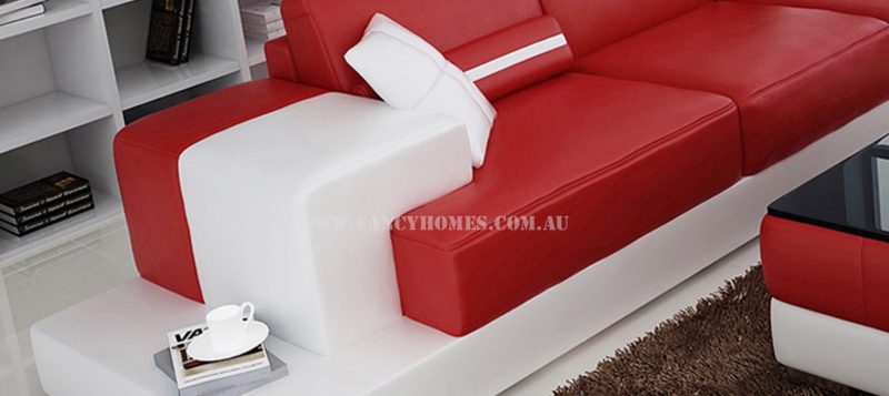 The Armrests of Fancy Homes Evelyn modular leather sofa features attractive design with open-shelf display