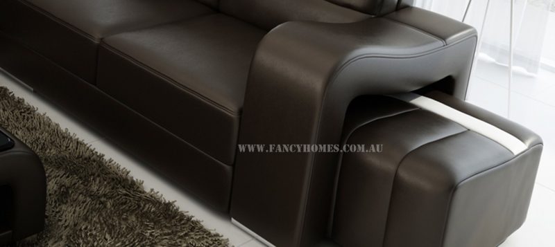 The curved armrest and removable ottoman of Fancy Homes Erika-B corner leather sofa.