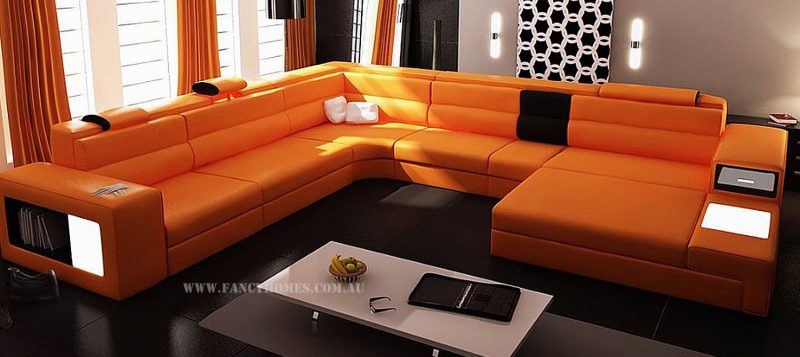 Fancy Homes Jolanda-B modular leather sofa in orange and black leather features adjustable headrests, lighting system, storage armrests and removable ottomans