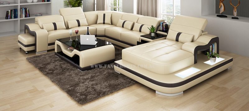 Fancy Homes Kori modular leather sofa in beige and black leather featuring LED lighting system, middle table with drawer and movable ottoman