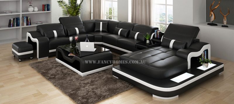 Fancy Homes Kori modular leather sofa in black and white leather featuring LED lighting system, middle table with drawer and movable ottoman