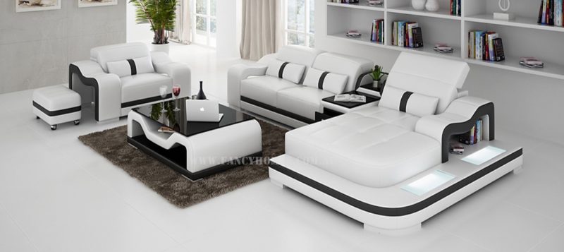 Fancy Homes Kori-E chaise leather sofa in white and black comes with a single seater. Featuring adjustable headrests, LED lighting system and storage middle table.