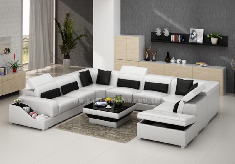 Fancy Homes Paloma corner leather sofa in white and black leather featuring easy-adjust headrests, book-shelf armrests and storage ottoman