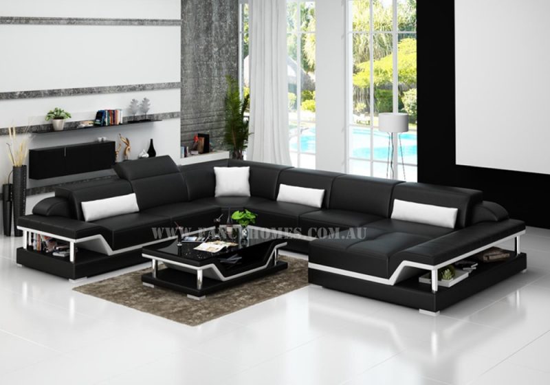 Fancy Homes Paxton modular leather sofa in black and white leather featuring adjustable headrests and storage armrests