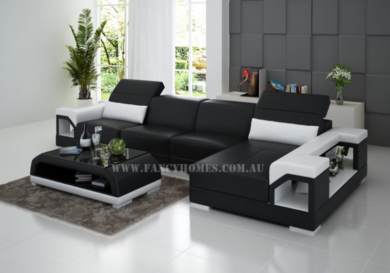 Fancy Homes Viva-C chaise leather sofa in black and white leather featuring easy-adjust headrests and storage arms