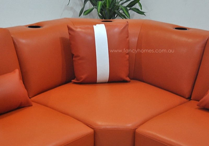 The corner of Fancy Homes Gianni modular leather sofa comes with cup holders